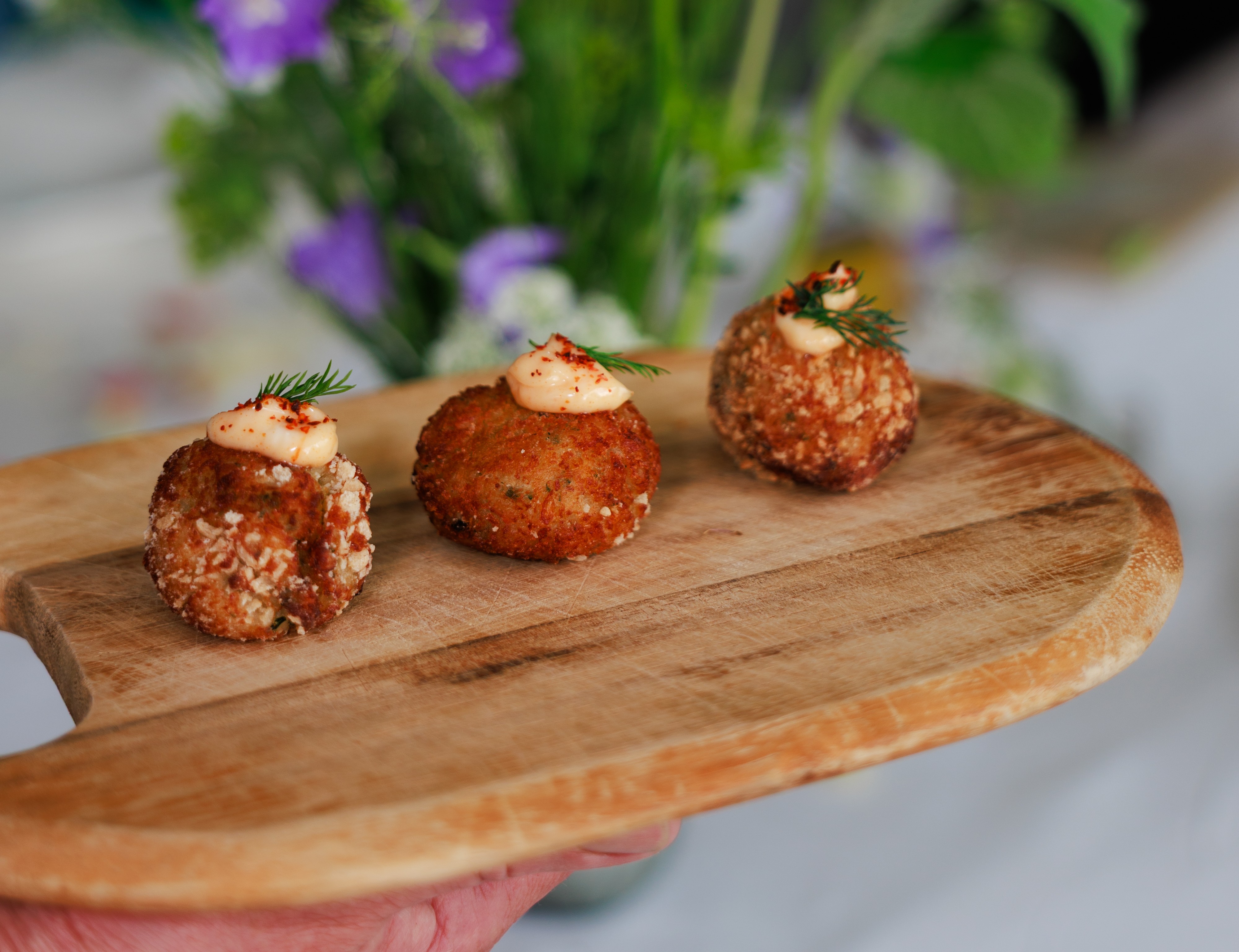 Arancini canapes on a wooden platter.JPG